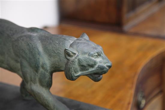A French Art Deco painted terracotta figure of a panther, 24in.